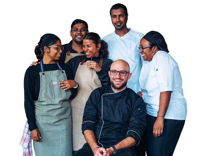Group of people wearing chef uniforms and aprons on a white background